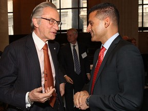 Paul Godfrey, left, president and chief executive officer of Postmedia Network speaks with Windsor Mayor Eddie Francis at a Toronto Region Board of Trade luncheon, Thurs. Oct. 24, 2013, in Toronto, Ont.  (DAN JANISSE/The Windsor Star)