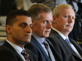 Mayor Eddie Francis, University of Windsor president Alan Wildeman and Vice President, Finance Peter McQuillan (left to right) take part in the announcement of a new FedEx cargo hub at the Windsor Airport in Windsor on Wednesday, October 2, 2013.          (TYLER BROWNBRIDGE/The Windsor Star)