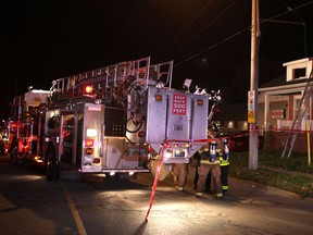 Windsor Fire and Rescue work at a house fire at 1361 Crawford Ave., Friday, Oct. 25, 2013.   (DAX MELMER/The Windsor Star)