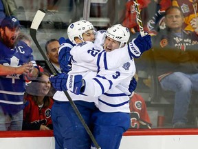 Toronto's  James Van Riemsdyk, left, celebrates his goal with teammate Dion Phaneuf during NHL action against the Flames in Calgary Wednesday, Oct. 30, 2013. (THE CANADIAN PRESS/Jeff McIntosh)