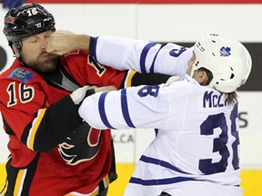 Calgary's Brian McGrattan, left, and Toronto's Frazer McLaren fight at the Scotiabank Saddledome in Calgary October 30, 2013. (Leah Hennel/Calgary Herald)