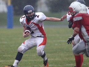 Sandwich's Noah Sigfries gets pressured by Brennan defenders during their game Thurs. Oct. 31, 2013, at Sandwich in Lasalle, Ont.  (DAN JANISSE/The Windsor Star)