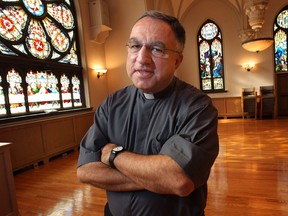 Rev. Thomas Rosica, president and vice-chancellor of Assumption University poses Tuesday, Oct. 1, 2013, at the Assumption chapel in Windsor, Ont. He is also president of the TV network, Salt & Light, a nationally televised Catholic network. (DAN JANISSE/The Windsor Star)