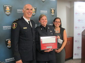 From left: Chief Al Frederick and Const. Leigh-Ann Godwin of Windsor police, with CAA  community relations manager Tracy Nickelford. Pictured Oct. 7, 2013. (Dalson Chen / The Windsor Star)