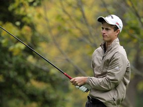 Devan Schulert watches his tee shot during the second round of the OFSAA golf championship at Essex Golf & Country Club in LaSalle on Thursday, October 17, 2013. (TYLER BROWNBRIDGE/The Windsor Star)