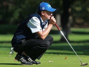 Nicholas Mihalo, of Holy Names, lines up a putt on the second hole during the OFSAA golf championships at the Essex Golf & Country Club, Wednesday, Oct. 16, 2013.  (DAX MELMER/The Windsor Star)