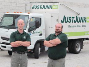 JustJunk.com franchisee David Hayes, left,  and employee Pat Middleton stand in front of one the trucks they use in their Windsor area operation.  (JASON KRYK/The Windsor Star)