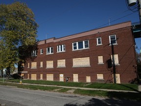 A boarded up apartment building next to The Ambassador Bridge on Indian Road. (Windsor Star files)
