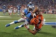 Cincinnati's Marvin Jones, left, catches a 12-yard touchdown as Detroit's Chris Houston defends in the second quarter Sunday, Oct. 20, 2013, in Detroit. (AP Photo/Jose Juarez)