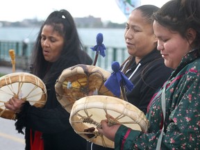 A group of aboriginal people with the Idle No More group sing during a demonstration on Oct. 7, 2013 in Dieppe Gardens in downtown Windsor to mark the 250th anniversary of the signing of the British Royal Proclamation and indigenous land rights. (DAN JANISSE/The Windsor Star)