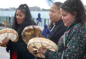 A group of aboriginal people with the Idle No More group sing during a demonstration on Oct. 7, 2013 in Dieppe Gardens in downtown Windsor to mark the 250th anniversary of the signing of the British Royal Proclamation and indigenous land rights. (DAN JANISSE/The Windsor Star)