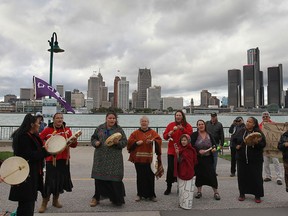 A group of aboriginal people with the Idle No More group sing during a demonstration on Oct. 7, 2013 in Dieppe Gardens in downtown Windsor to mark the 250th anniversary of the signing of the British Royal Proclamation and indigenous land rights. (DAN JANISSE/The Windsor Star)