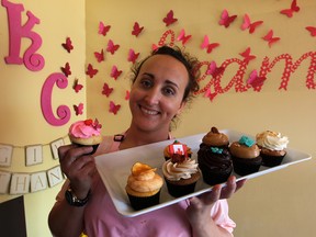 Sonia Klue with a sample of her elaborate cupcakes at Klueless Cupcakes on Wyandotte Street East. (NICK BRANCACCIO / The Windsor Star)