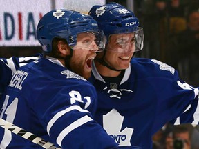 Phil Kessel, left, and Tyler Bozak of the Toronto Maple Leafs celebrate Bozak's goal against the Minnesota Wild at the Air Canada Centre October 15, 2013 in Toronto. (Abelimages/Getty Images)