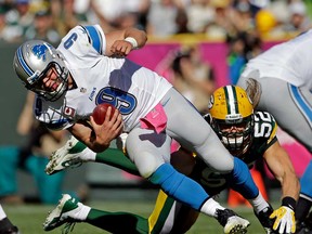 Green Bay's Clay Matthews, right, sacks Detroit quarterback Matthew Stafford during the second half Sunday, Oct. 6, 2013, in Green Bay, Wis. (AP Photo/Morry Gash)