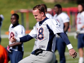 Denver QB Peyton Manning warms up at the team's practice facility in Englewood, Colo., Wednesday, Oct. 16, 2013. Manning will  lead the Broncos against the Indianapolis Colts Sunday. (AP Photo/Ed Andrieski)