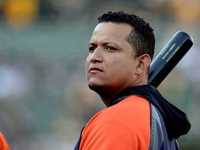 Detroit's Miguel Cabrera takes a break during batting practice before Game 2 of the American League Division Series against the Oakland Athletics on October 5, 2013 in Oakland, California.  (Thearon W. Henderson/Getty Images)