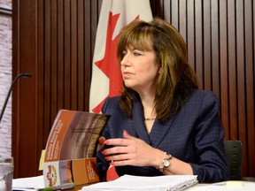 Ontario Auditor General Bonnie Lysyk talks about her report on the costs of cancelling the Oakville gas plant project at the legislature at Queen's Park in Toronto, Tuesday, Oct. 8, 2013. (Frank Gunn/The Canadian Press)