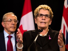 Ontario Premier Kathleen Wynne speaks to the media regarding the cancellation of two southern Ontario gas plants at Queen's Park in Toronto on Tuesday, Oct. 8, 2013. Steve Swain of LaSalle says Ontario taxpayers shouldn't have to pay for the Liberals' "mismanagement." (Canadian Press files)