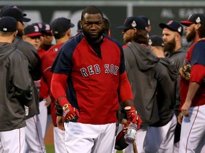 Boston's David Ortiz, centre, looks on during a workout at Fenway Park on October 22, 2013 in Boston. The Red Sox host the Cardinals in Game 1 Wednesday October 23, 2013.  (Rob Carr/Getty Images)