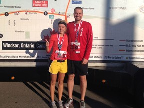 Nadia Barzotto and Stephen Gomes, a husband and wife team of Tecumseh finish their first half marathon together on Sunday, Oct. 20, 2013 in 2:03:04. (Special to The Star)