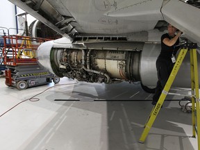 Nicole Ouellette works on a Boeing 737 inside the hanger at Premier Aviation in Windsor on Wednesday, October 2, 2013.          (TYLER BROWNBRIDGE/The Windsor Star)