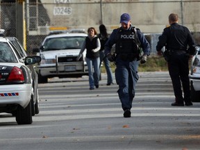 Windsor police converge in the 1500 block of Windermere Road in response to a stabbing incident on Oct. 23, 2014. (Nick Brancaccio / The Windsor Star)