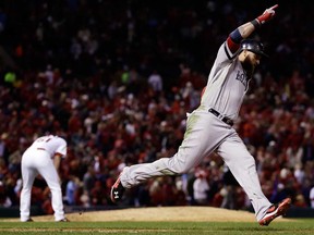 Boston's Jonny Gomes celebrates his three-run homer off St. Louis Cardinals relief pitcher Seth Maness, left, during  Game 4 of the World Series Sunday, Oct. 27, 2013, in St. Louis. (AP Photo/Jeff Roberson)