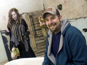 Shawn Lippert, owner of Scarehouse Windsor, along with dressed-up Colleen Lippert, prepare for another night of scaring people at the haunted house on Ouellette Avenue Sunday, Oct. 27, 2013. (JOEL BOYCE/The Windsor Star)