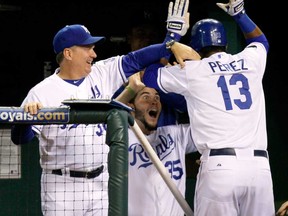 Royals hitting coach Kevin Seitzer, left, congratulates Salvador Perez after a 2011 home run n Kansas City, Seitzer was hired Thursday as the new hitting coach for the Toronto Blue Jays. (Ed Zurga/Getty Images)