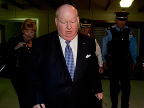 Senator Mike Duffy leaves the Parliament buildings after speaking in front of the Senate Tuesday, October 22, 2013 in Ottawa. (Adrian Wyld/The Canadian Press)