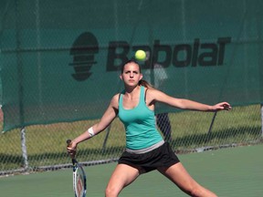 Assumption's Magda Bedmarek returns a shot during mixed doubles action in the WECSSAA Tennis Championships at Parkside Tennis Club in Windsor, Ontario. (JASON KRYK/The Windsor Star)