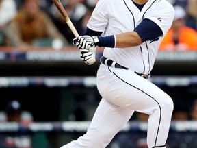 Detroit's Victor Martinez hits an RBI double in the fourth inning against the Oakland Athletics during Game 3 of the American League Division Series at Comerica Park on October 7, 2013 in Detroit.  (Leon Halip/Getty Images)