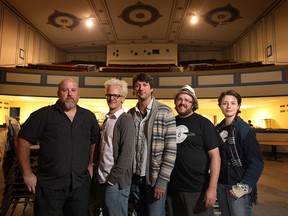 Terry Lusk, left, Jake Dimmick, John Pilat, Dan Wells and Tara Murphy pose inside the Olde Walkerville Theatre earlier this week in Windsor. Lusk, Dimmick and Pilat and Bob Stewart, not pictured, are part of the band Waker Glass which will play at Books and Tunes Saloon on Friday. Wells and Murphy are with event organizer Biblioasis. (DAN JANISSE / The Windsor Star)
