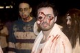 Windsor Zombie Walk participant Brendan Armstrong keeps an eye out on Ouellette Avenue on Oct. 5, 2013. (Joel Boyce / The Windsor Star)