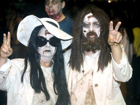 Dick and Leslie Walsh attended the seventh-annual Windsor Zombie Walk in downtown Windsor as undead-John Lennon and Yoko Ono Saturday, Oct. 05, 2013. (JOEL BOYCE/The Windsor Star)