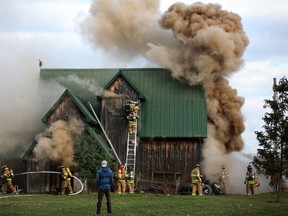 Amherstburg fire crews work to put out a barn fire at Spucewood Shores Estate Winery in Amherstburg, Saturday, Nov. 9, 2013.  (DAX MELMER/The Windsor Star)