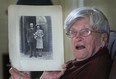 Kay May, 99, shows off a photo from her wedding day, Friday, Nov. 8, 2013, at her home near Harrow. She married John May on  July 18, 1942. At 99-years-old, the native of England is one of the oldest war brides in Canada. (DAN JANISSE/The Windsor Star)