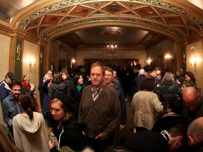 Moviegoers line up inside the Capitol Theatre as other exit on Friday night for the Windsor International Film Festival, Nov. 8, 2013. (DAX MELMER/The Windsor Star)