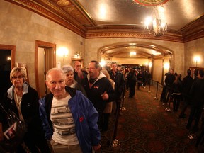 Moviegoers line up inside the Capitol Theatre as other exit on Friday night for the Windsor International Film Festival, Nov. 8, 2013. (DAX MELMER/The Windsor Star)