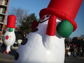 Blow up Frosty the Snowmen make their way down Ouellette Avenue during the Holiday Parade, Saturday, Nov. 30, 2013.  (DAX MELMER/The Windsor Star)