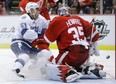 Tampa Bay's Valtteri Filppula, left, has his shot stopped by Detroit goalie Jimmy Howard Saturday. (AP Photo/Carlos Osorio)