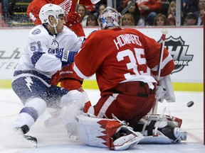 Tampa Bay's Valtteri Filppula, left, has his shot stopped by Detroit goalie Jimmy Howard Saturday. (AP Photo/Carlos Osorio)