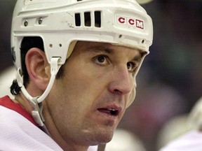 Detroit's Brendan Shanahan looking out from the bench against the Calgary Flames at Joe Louis Arena in 2001. (AP Photo/Paul Sancya, File)