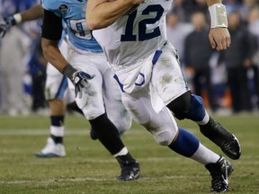 Indianapolis quarterback Andrew Luck, right, scores a touchdown on an 11-yard run against Tennessee. (AP Photo/Wade Payne)