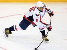 Washington's Alex Ovechkin takes a shot against the Avalanche at the Pepsi Center. (Photo by Doug Pensinger/Getty Images)