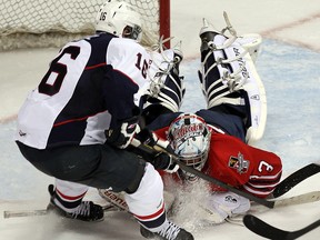 Windsor forward Kerby Rychel, left, is stopped by Oshawa goalie Daniel Altshuller at the WFCU Centre. (TYLER BROWNBRIDGE/The Windsor Star)