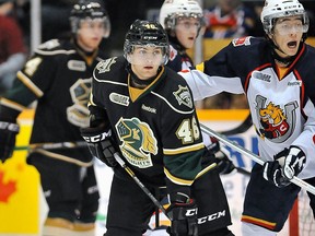 London's Matt Rupert, left, was suspended 15 games for a hit against Barrie. (OHL Images)