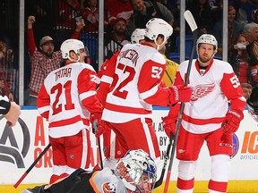 The Wings celebrate a goal by Pavel Datsyuk on New York goalie Evgeni Nabokov. (Photo by Al Bello/Getty Images)