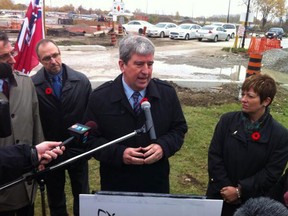 Transportation Minister Glen Murray and Teresa Piruzza at a press conference announced hunders of girders will be replaced on the Herb Gray Parkway. (TwitPic: Dax Melmer)